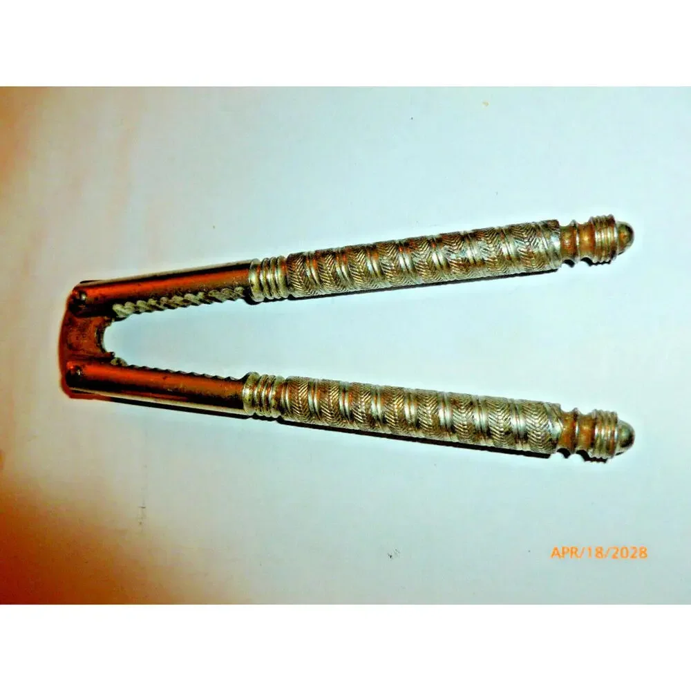 Antique Nutcracker Pat 1909 Herringbone Pattern‎